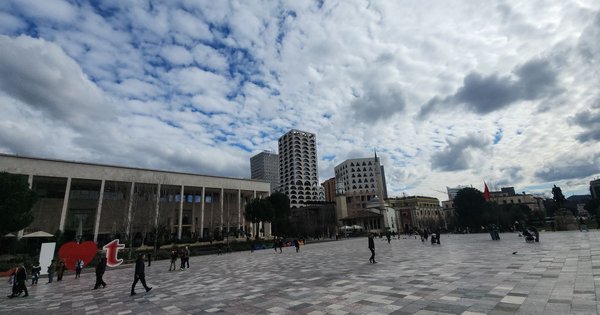View over the rooftops and central square of Tirana, Albania, with a clear sky